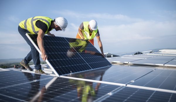 Engineers installing solar panels